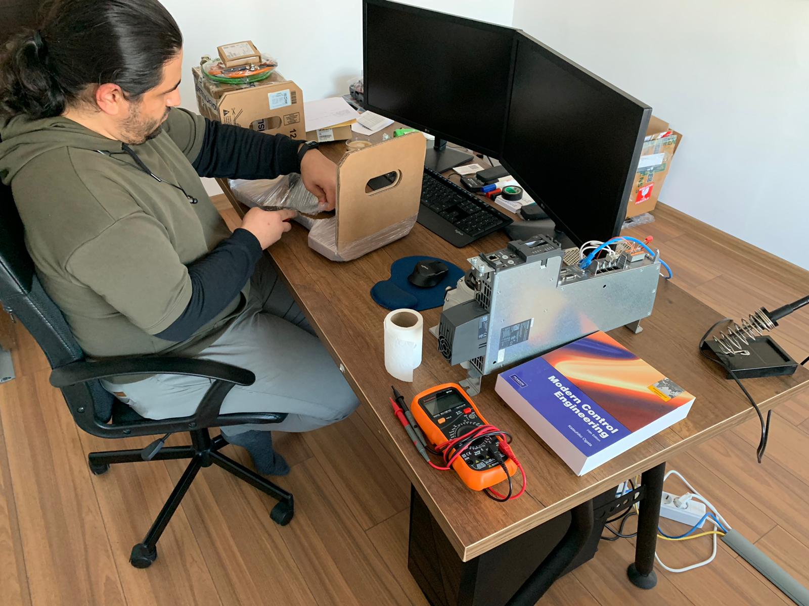 Mehmet Can Turk with Siemens components for the HydroFoamer construction phase